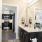 Model bathroom at our senior living apartments in Buford, GA, featuring white countertops and black cabinetry
