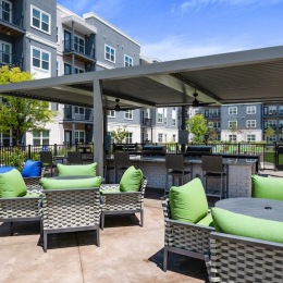 a patio area with tables and chairs