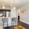 Model kitchen at our senior living apartments in Buford, GA, featuring wood grain flooring and stainless steel appliances