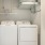 The laundry closet at our apartments in Buford, GA, featuring in unit washer dryers and white closet doors