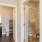 The hallway at our senior living apartments in Buford, GA, featuring a view of the hall closet and the bathroom