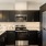 a kitchen with black appliances